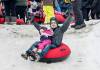 JOHN WOODS / FREE PRESS
                                Dallas Orysiuk and daughter Daniella slide down a hill at Festival du Voyageur Sunday.