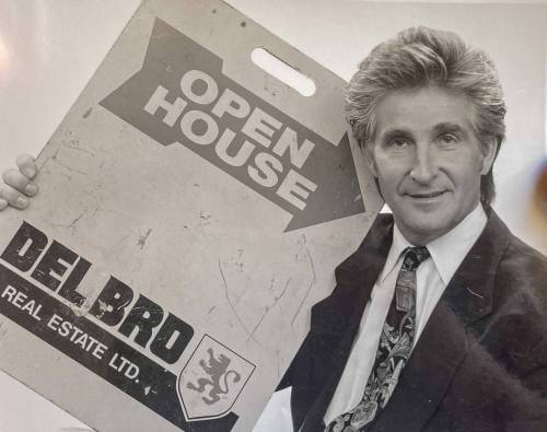 SUPPLIED
                                Rod posing with an open house sandwich board.