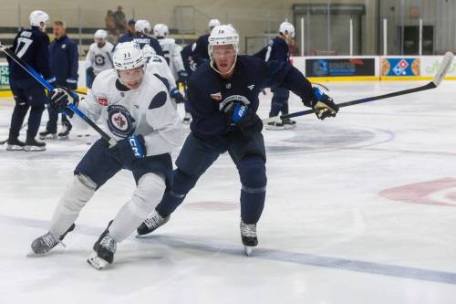 MIKE DEAL / FREE PRESS Winnipeg Jets&rsquo; Walker Duehr (71) and Jonathan Toews (19) during training camp at Hockey For All Centre in September.
