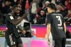 Bayern's Kim Min-jae, right, celebrates with Bayern's Dayot Upamecano after scoring his side's second goal during the German Bundesliga soccer match between 1.FC Koeln and FC Bayern Munich in Cologne, Germany, Wednesday, Jan. 14, 2026. (AP Photo/Martin Meissner)