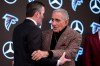 Atlanta Falcons head coach Kevin Stefanski embraces team owner Arthur Blank after a NFL Atlanta Falcons news conference, Tuesday, Jan. 27, 2026, in Atlanta. (AP Photo/Mike Stewart)