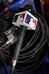 A microphone belonging to a field reporter for the San Diego Padres sits on top of audio cables during a baseball game between the Miami Marlins and the Padres, May 31, 2023, in Miami. (AP Photo/Wilfredo Lee, File)