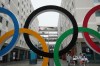 Athletes from France walk inside the Olympic Village ahead of the 2026 Winter Olympics, in Milan, Italy, Tuesday, Feb. 3, 2026. (AP Photo/Antonio Calanni)