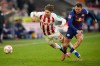 Cologne's Jan Thielmann, left, and Leipzig's David Raum fight for the ball during a German Bundesliga soccer match between Cologne and Leipzig in Cologne, Germany, Sunday, Feb. 8, 2026. (AP Photo/Martin Meissner)