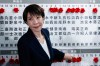 Sanae Takaichi, center, Japan's prime minister and president of the ruling Liberal Democratic Party (LDP), puts pins marking the names of candidates who won lower house elections, at the LDP headquarters Sunday, Feb. 8, 2026 in Tokyo, (Kim Kyung-Hoon/Pool Photo via AP)
