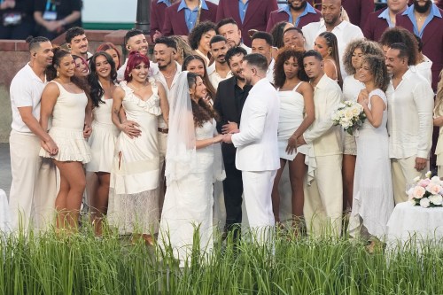 A couple dressed as a bride and groom participate in the Bad Bunny performance during halftime of the NFL Super Bowl 60 football game between the Seattle Seahawks and the New England Patriots, Sunday, Feb. 8, 2026, in Santa Clara, Calif. (AP Photo/Frank Franklin II)