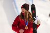 Megan Oldham, of Canada, reacts after winning the bronze medal in the women's freeski slopestyle final at the Milano Cortina 2026 Winter Olympic Games in Livigno, Italy on Monday, Feb. 9, 2026. THE CANADIAN PRESS/Sean Kilpatrick