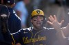 FILE - Milwaukee Brewers' Caleb Durbin celebrates after scoring against the Los Angeles Dodgers during the second inning in Game 3 of baseball's National League Championship Series, Oct. 16, 2025, in Los Angeles. (AP Photo/Brynn Anderson)