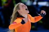 Jutta Leerdam of the Netherlands celebrates winning the gold medal in the women's 1,000 meters speedskating race at the 2026 Winter Olympics, in Milan, Italy, Monday, Feb. 9, 2026. (AP Photo/Luca Bruno)