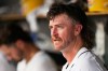 FILE - Detroit Tigers starting pitcher Chris Paddack sits in the dugout during the sixth inning of a baseball game against the Arizona Diamondbacks, July 30, 2025, in Detroit. (AP Photo/Ryan Sun, file)