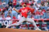 FILE - Cincinnati Reds starting pitcher Nick Martinez delivers during the first inning of a baseball game against the Los Angeles Angels, Aug. 20, 2025, in Anaheim, Calif. (AP Photo/William Liang)