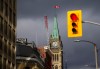 The Peace Tower on Parliament Hill reflects the setting sun in downtown Ottawa on Friday, Oct. 24, 2025. THE CANADIAN PRESS/Sean Kilpatrick