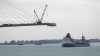 FILE - The Saginaw passes construction on the Gordie Howe International Bridge connecting on the Detroit River connecting Windsor, Ontario and Detroit, Oct. 25, 2023. (AP Photo/Paul Sancya, File)