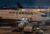 Cargo is loaded onto an Air Canada plane at Montreal-Pierre Elliott Trudeau International Airport in Montreal on Sunday, Nov. 30, 2025. THE CANADIAN PRESS/Christinne Muschi