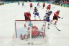 United States' Hilary Knight, (21), celebrates after a goal gets past Switzerland's goaltender Andrea Braendli in the third period of the preliminary round match of the women's ice hockey between Switzerland and the United States, at the 2026 Winter Olympics, in Milan, Italy, Monday, Feb. 9, 2026. (Bruce Bennett/Pool Photo via AP)