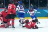 Abbey Murphy (37) of Team United States celebrates after a goal as Team Canada players look on during second period Olympic hockey action at the 2026 Milan Cortina Winter Olympics in Milan, Italy on Tuesday, Feb. 10, 2026. THE CANADIAN PRESS/Nathan Denette