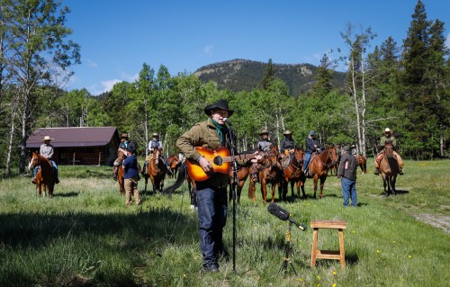 Singer Corb Lund, centre, sings on land proposed for coal mine development in the eastern slopes of the Livingstone range south west of Longview, Alta., Wednesday, June 16, 2021.THE CANADIAN PRESS/Jeff McIntosh