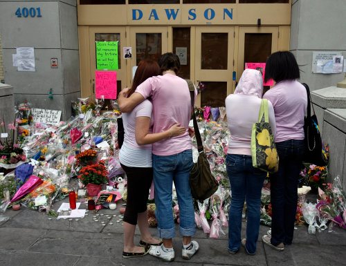 Students wear pink in honour of Anastasia De Sousa before they re-enter Dawson College in Montreal Monday, Sept. 18, 2006. THE CANADIAN PRESS/Ryan Remiorz