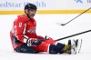 Washington Capitals left wing Alex Ovechkin (8) sits on the ice after he was tripped by Nashville Predators defenseman Brady Skjei, not seen, during the first period of an NHL hockey game, Thursday, Feb. 5, 2026, in Washington. (AP Photo/Nick Wass)