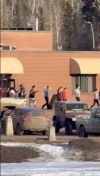 A total of nine people are dead after a pair of shootings Tuesday in the tiny community of Tumbler Ridge in B.C.'s Peace region. The community went into a lockdown that lasted several hours, after police were called about an active shooter at Tumbler Ridge Secondary School. In this still from a video provided to The Associated Press from the scene, students are seen being escorted out of the school with their hands in the air.
THE CANADIAN PRESS/AP-Jordon Kosik