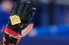 Ukraine's Dmytro Shepiuk holds a sticker reading 