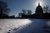 The sun sets behind the U.S. Capitol on Capitol Hill, Tuesday, Feb. 10, 2026, in Washington. (AP Photo/Tom Brenner)
