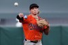 FILE - Baltimore Orioles second baseman Jackson Holliday throws to first for an out on San Francisco Giants' Drew Gilbert to end a baseball game Saturday, Aug. 30, 2025, in San Francisco. (AP Photo/Godofredo A. Vásquez, File)