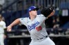 FILE - Los Angeles Dodgers relief pitcher Evan Phillips throws to the plate during the ninth inning of an opening day baseball game against the San Diego Padres at the Gocheok Sky Dome in Seoul, South Korea March 20, 2024, in Seoul, South Korea. (AP Photo/Ahn Young-joon, File)