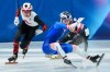 Canada's Courtney Sarault, left, avoids a collision with Corinne Stoddard of the United States, front right, as she falls in front of South Korea's Kim Gilli, back right, during the short-track speedskating mixed team relay semifinal at the 2026 Winter Olympics, in Milan on Tuesday, Feb. 10, 2026. THE CANADIAN PRESS/Darryl Dyck