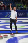 American curler Korey Dropkin reacts during the mixed doubles semifinal against Italy at the 2026 Winter Olympics in Cortina d'Ampezzo, Italy on Feb. 9, 2026. (AP Photo/Fatima Shbair)