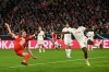 Bayern's Harry Kane, left, misses a chance during the German Cup soccer match between Bayern Munich and RB Leipzig in Munich, Germany, Wednesday, Feb. 11, 2026. (Sven Hoppe/dpa via AP)