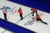 Canada's Emma Miskew, Sarah Wilkes and Tracy Fleury compete against Denmark during a women's curling round robin session at the 2026 Winter Olympics, in Cortina d'Ampezzo, Italy, Thursday, Feb. 12, 2026. (AP Photo/David J. Phillip)