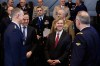 NATO Secretary General Mark Rutte, second left, introduces United States Undersecretary of Defense for Policy Elbridge Colby, center, to military staff during a meeting of the North Atlantic Council in Defense Ministers Session at NATO headquarters in Brussels, Thursday, Feb. 12, 2026. (AP Photo/Geert Vanden Wijngaert)