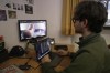 Doctoral student Marco Granata reviews footage he captured of stoats, Wednesday, Feb. 11, 2026, in Turin, Italy. (AP Photo/Brittany Peterson)