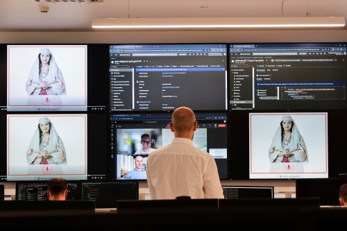 FILE - Albanian experts work at the National Agency for Information Society as an artificial intelligence 
