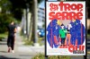 FILE - A poster of the Swiss People's Party (SVP) for a moderate immigration initiative reading 'we're too tight!' is displayed in a street in Lausanne, Switzerland, Sept. 8, 2020. (Laurent Gillieron/Keystone via AP, File)