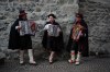 Accordion players, from left, Marco Compagnoni, Alberto Canclini, and Flavio Bottoni perform in the street in Bormio, Italy, during the 2026 Winter Olympics, Sunday, Feb. 8, 2026. (AP Photo/Rebecca Blackwell)