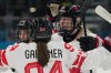 Canada's Kristin O'Neill, left, celebrates after scoring her side's third goal during a preliminary round match of women's ice hockey between Finland and Canada at the 2026 Winter Olympics, in Milan, Italy, Thursday, Feb. 12, 2026. (AP Photo/Hassan Ammar)