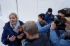 International Olympic Committee President Kirsty Coventry, left, talks to the media at the start house of the sliding center at the 2026 Winter Olympics, in Cortina d'Ampezzo, Italy, Thursday, Feb. 12, 2026. (AP Photo/Fatima Shbair)