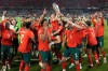FILE - Portugal's players celebrate with the trophy after winning the Nations League soccer championship at the Allianz Arena in Munich, Germany, June 8, 2025. (AP Photo/Martin Meissner, File)