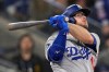 FILE - Los Angeles Dodgers' Max Muncy watches his home run hit against the Toronto Blue Jays during the eighth inning in Game 7 of baseball's World Series, Nov. 1, 2025, in Toronto. (AP Photo/Brynn Anderson, File)