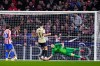 Barcelona's goalkeeper Joan Garcia, right, misses Atletico Madrid side's second goal by Antoine Griezmann, not in the picture, during the Copa del Rey semifinal first leg soccer match between Atletico Madrid and Barcelona in Madrid, Spain, Thursday, Feb. 12, 2026. (AP Photo/Manu Fernandez)