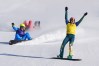 Australia's Josie Baff (17) celebrates her gold medal win past bronze medalist Italy's Michela Moioli (6) and Switzerland's Noemie Wiedmer (3) compete during the women's snowboard cross finals at the 2026 Winter Olympics, in Livigno, Italy, Friday, Feb. 13, 2026. (AP Photo/Lindsey Wasson)