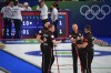 Canada's Brad Jacobs, Marc Kennedy, Brett Gallant, and Ben Hebert gesture during the men's curling round-robin session against the United States at the 2026 Winter Olympics in Cortina d'Ampezzo, Italy on Feb. 13, 2026. (AP Photo/Fatima Shbair)