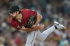FILE - Arizona Diamondbacks starting pitcher Zac Gallen works against a San Diego Padres batter during the third inning of a baseball game Friday, Sept. 26, 2025, in San Diego. (AP Photo/Gregory Bull,File)