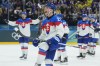 Slovakia's Juraj Slafkovsky celebrates end of a preliminary round match of men's ice hockey between Sweden and Slovakia at the 2026 Winter Olympics, in Milan, Italy, Saturday, Feb. 14, 2026. (AP Photo/Petr David Josek)