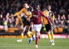 Burton Albion's Kain Adom, left, and West Ham United's Soungoutou Magassa in action during the English FA Cup fourth round soccer match between Burton Albion and West Ham United in Burton upon Trent, England, Saturday Feb. 14, 2026. (Mike Egerton/PA via AP)