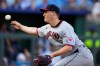 FILE - Cleveland Guardians relief pitcher Paul Sewald throws during the 10th inning of a baseball game against the Kansas City Royals, March 27, 2025, in Kansas City, Mo. (AP Photo/Charlie Riedel, File)