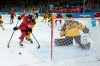 Canada's Julia Gosling (88) gets checked by Germany's Ronja Hark (8) to miss an empty net behind Germany goalie Sandra Abstreiter during the second period of a women's hockey quarterfinal game at the 2026 Winter Olympics, in Milan, Saturday, Feb. 14, 2026. THE CANADIAN PRESS/Darryl Dyck