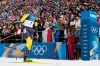 Martin Ponsiluoma, of Sweden, crosses the finish line for gold during the men's 12.5-kilometer pursuit biathlon race at the 2026 Winter Olympics in Anterselva, Italy, Sunday, Feb. 15, 2026. (AP Photo/David J. Phillip)